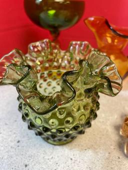 Colorful glassware, including Amberina, LE Smith, moon and stars, green hobnail and Amber vase and