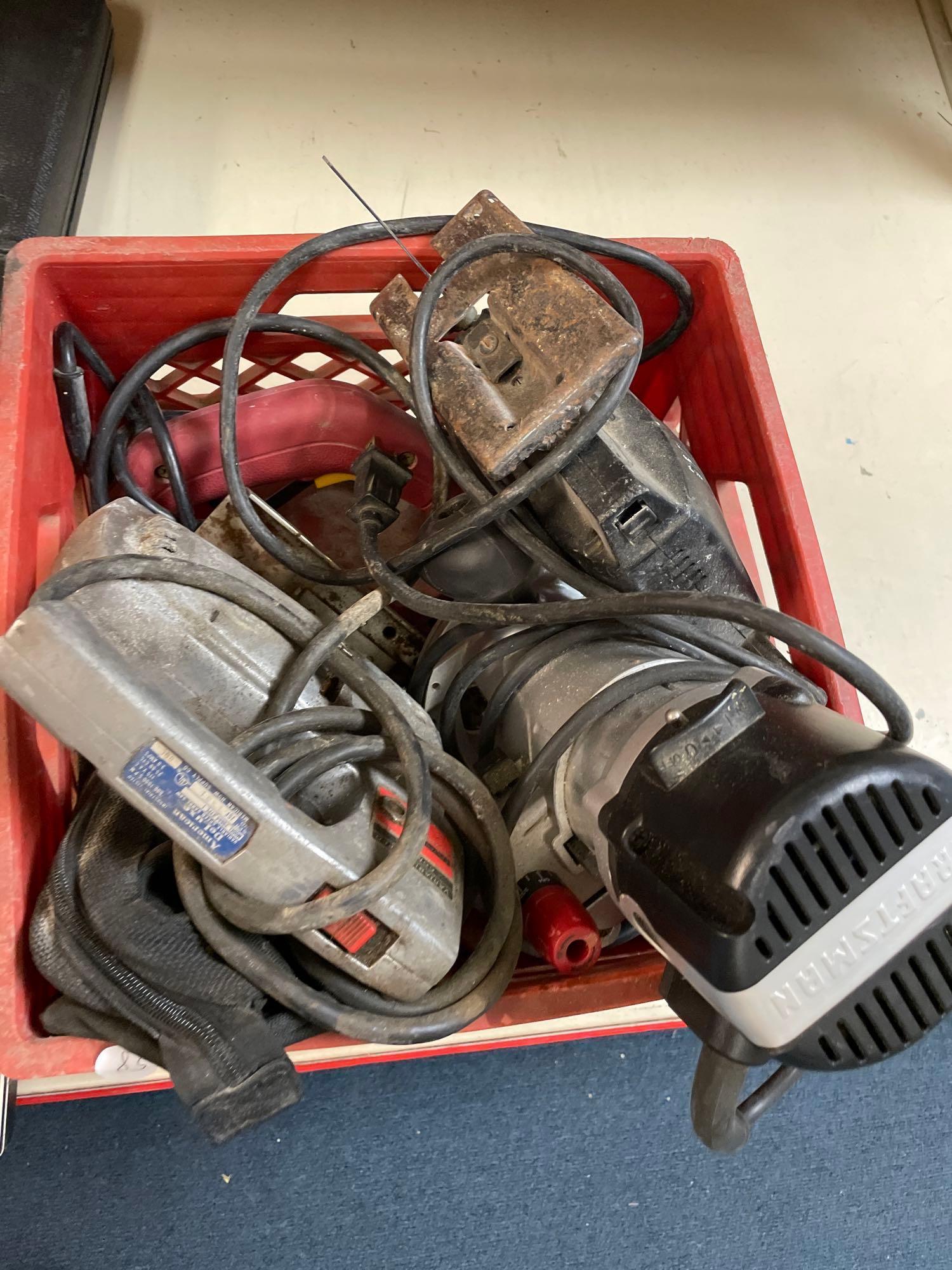 Various power tools including a saw