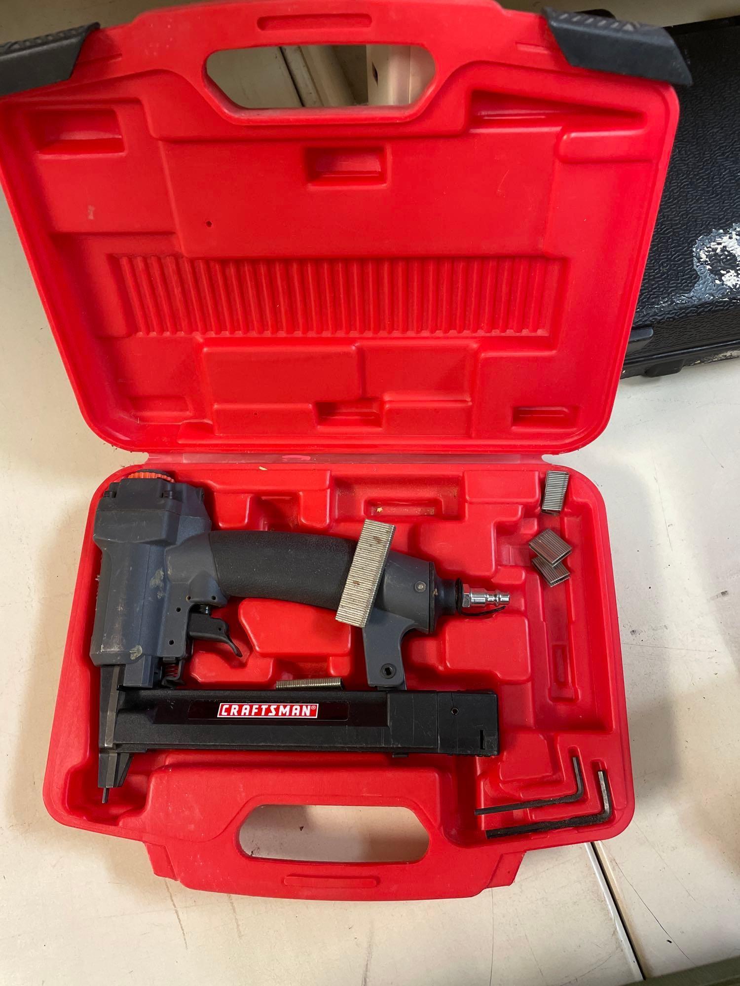 Various power tools including a saw