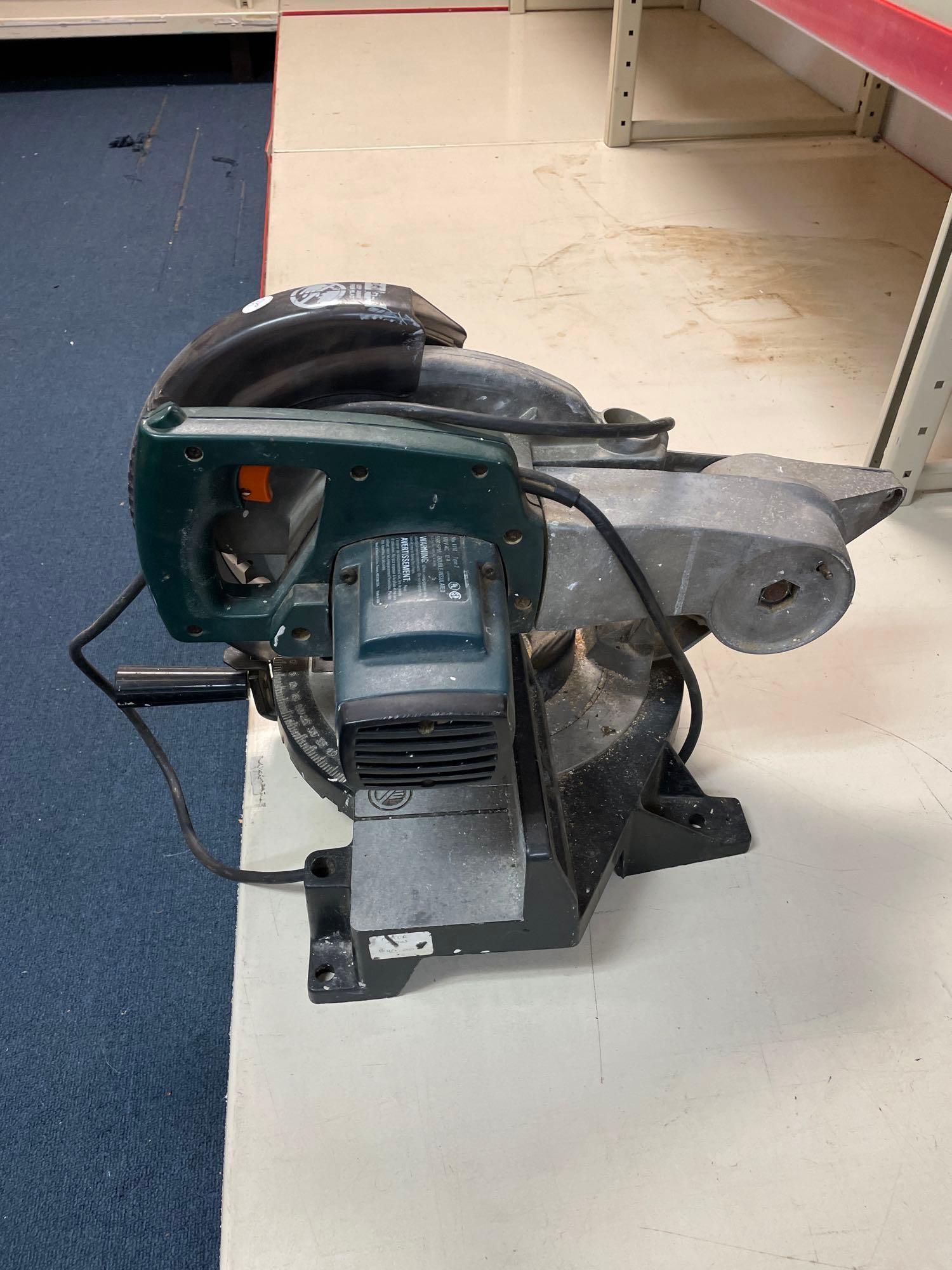 Various power tools including a saw