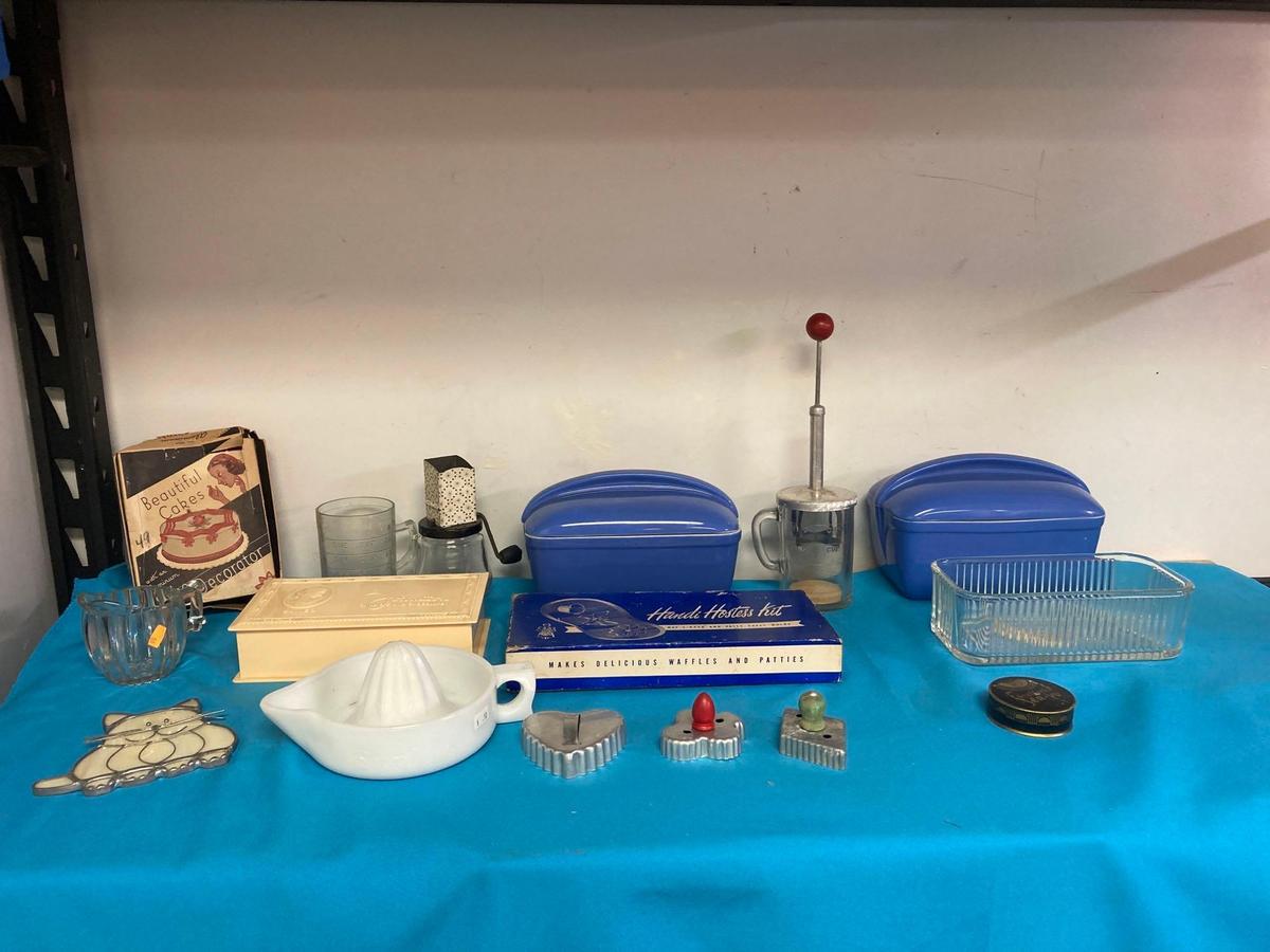 Hall refrigerator dishes along with other vintage kitchen items, cookie cutters, molds, cake