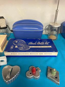 Hall refrigerator dishes along with other vintage kitchen items, cookie cutters, molds, cake