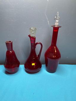 Three Red glass vases, Two with glass stoppers, One crackle vase