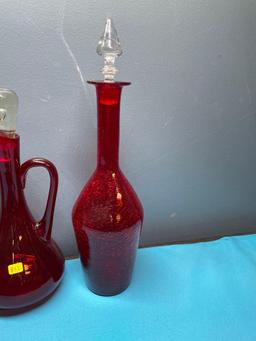 Three Red glass vases, Two with glass stoppers, One crackle vase