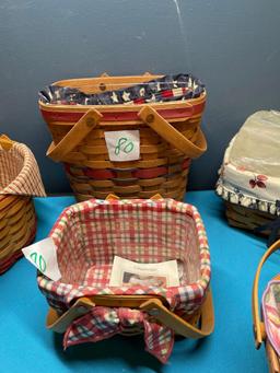 Five Longaberger baskets and one country woven basket