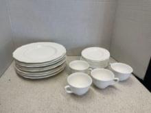 Milk, glass plates, cups, and saucers