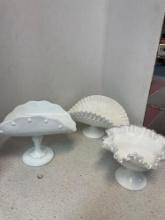Two milk glass banana boat dishes and a Fenton ruffled edge compote