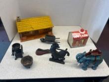 cast iron collectible figurines, bottle opener elephant, and more and can log cabin syrup and log