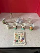 Ceramic egg cups, glass decanter, flower frog, more