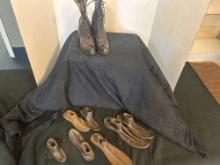 small antique leather boots and cast-iron shoe sizing equipment