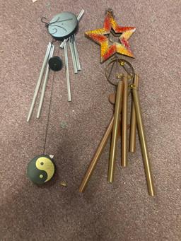 Two windchimes and a basket that could be used for a planter