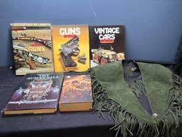 Books on guns and automobiles and suede fringed shawl or collar