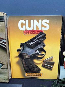 Books on guns and automobiles and suede fringed shawl or collar
