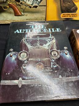 Books on guns and automobiles and suede fringed shawl or collar