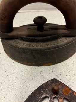3 sad irons, iron rests and a brass eagle door knocker