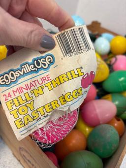 Crate full of plastic Easter eggs, Some are lights