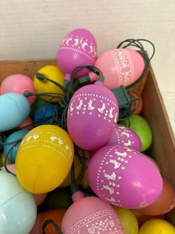 Crate full of plastic Easter eggs, Some are lights