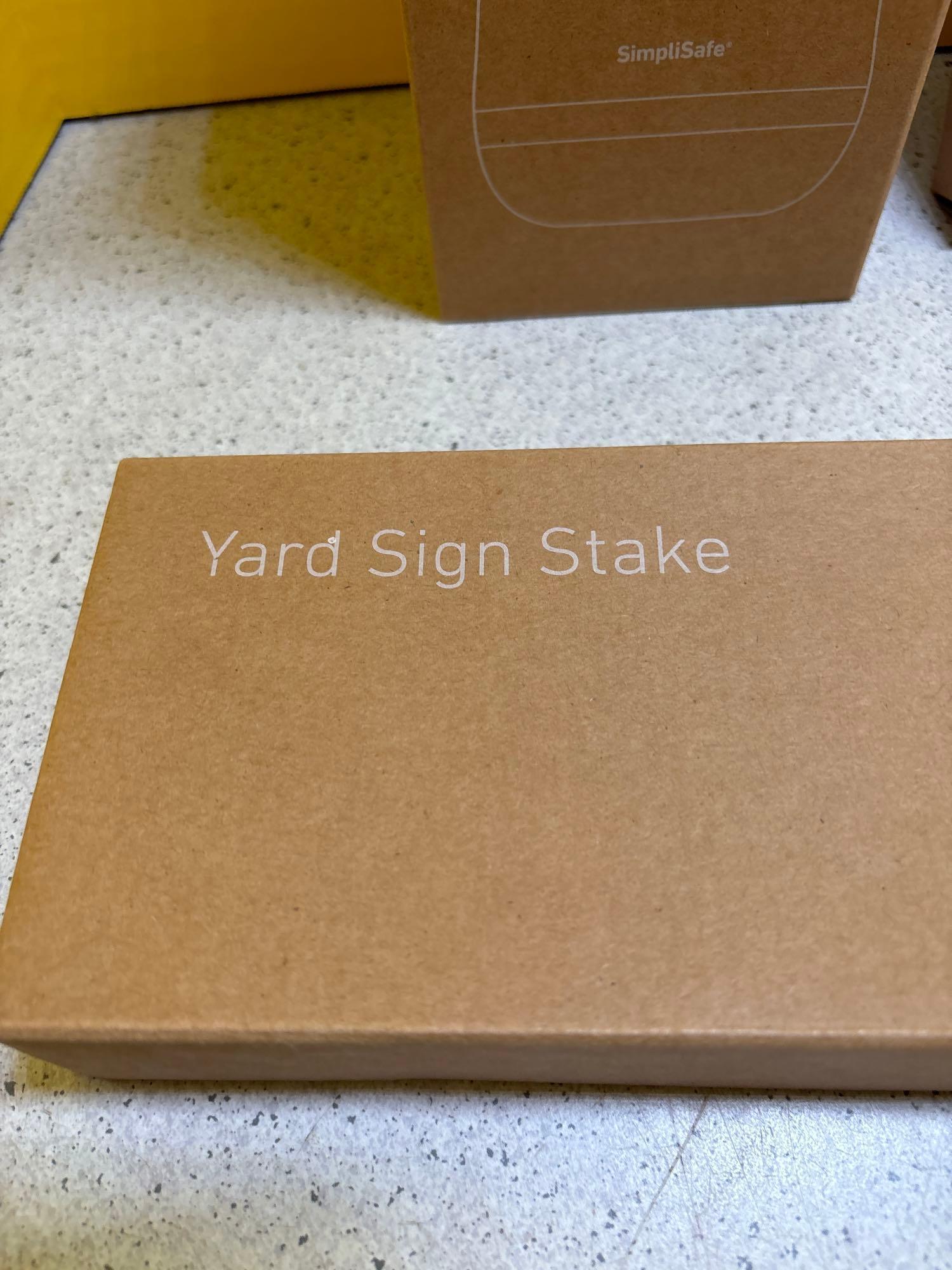 Base station, keypad, motion, panic, and entry buttons, yard sign stake