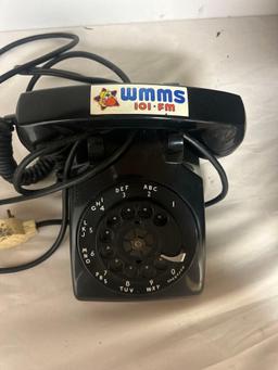 vintage black rotary dial telephone with WMMS sticker