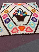 Very large colorful afghan, flower basket