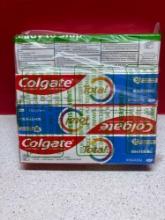 four tubes of Colgate whitening toothpaste