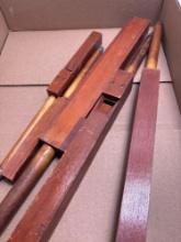Five wooden pipe organ pipes