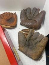 3 old baseball gloves, Nellie fox, and two others