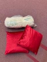Neck roll pillow and two other pillows