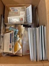 Box of stamps envelopes book supplies