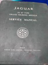 Three vintage automobile books on Jaguars