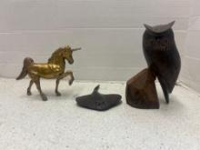 brass unicorn and wooden carved animals
