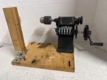 manual winder counter on wooden stand