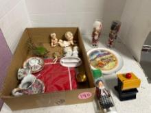 collectible baby figures, cups and saucers, and collectibles