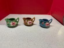 Three Roseville pottery creamers