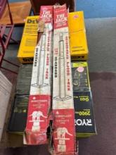 Two adjustable floor jacks