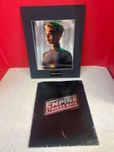 Star Wars, the Empire strikes back 20th Century Fox movie notes in folder and Star Trek seven of