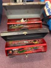 two metal toolboxes with tools
