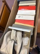 8 pairs of shoes in boxes