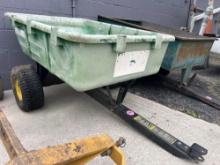 John Deere dumping plastic yard cart