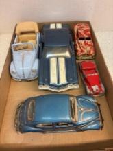 Five metal cars