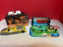 4 toy cars , 1 windup train roundabout