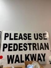 Please use pedestrian walkway, metal sign