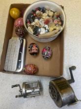 antique fishing reels, button collection, painted eggs