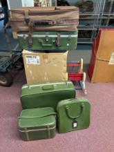 Five pieces of vintage luggage