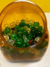 Jar of ornamental glass balls