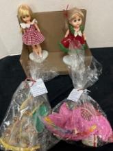 2 vintage dolls with clothing