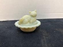 miniature custard glass cat on nest glows