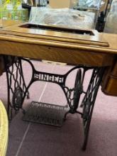 Singer, sewing machine with red eye machine