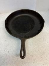 Vintage cast-iron skillet marked 10 B with smoke ring