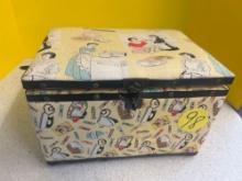sewing basket with fabric covering of 1950s housewives and household items